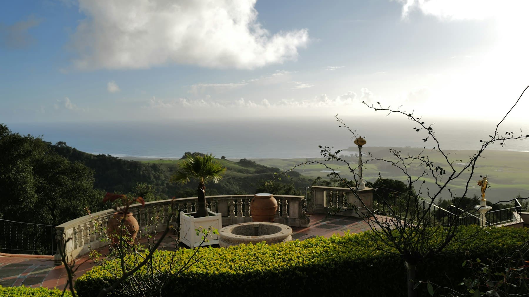 Terrace overlooking the ocean and green coastal hills, the mild climate behind San Diego's planting zones