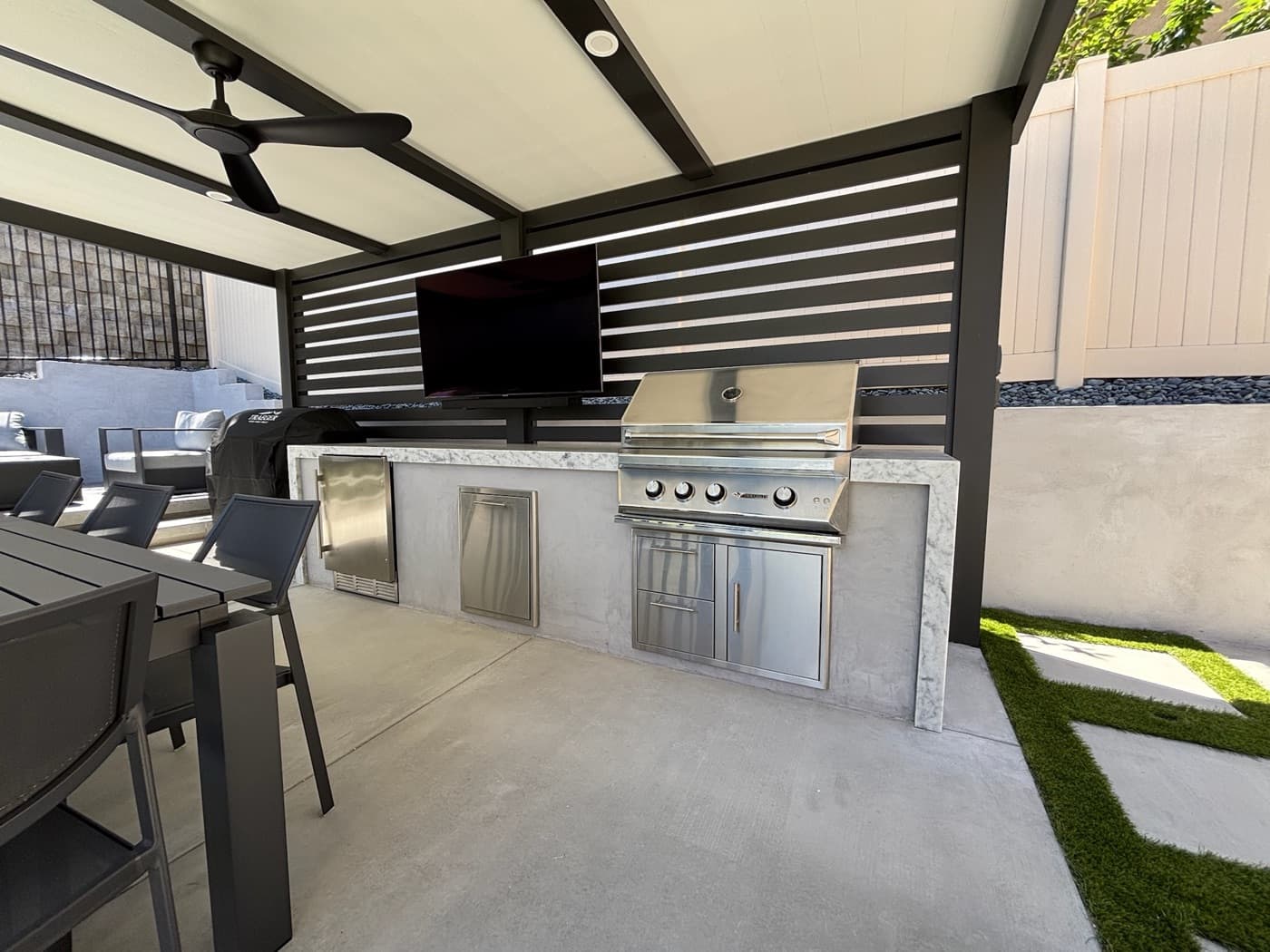 Outdoor kitchen and patio by Modern Yardz in Rancho Bernardo