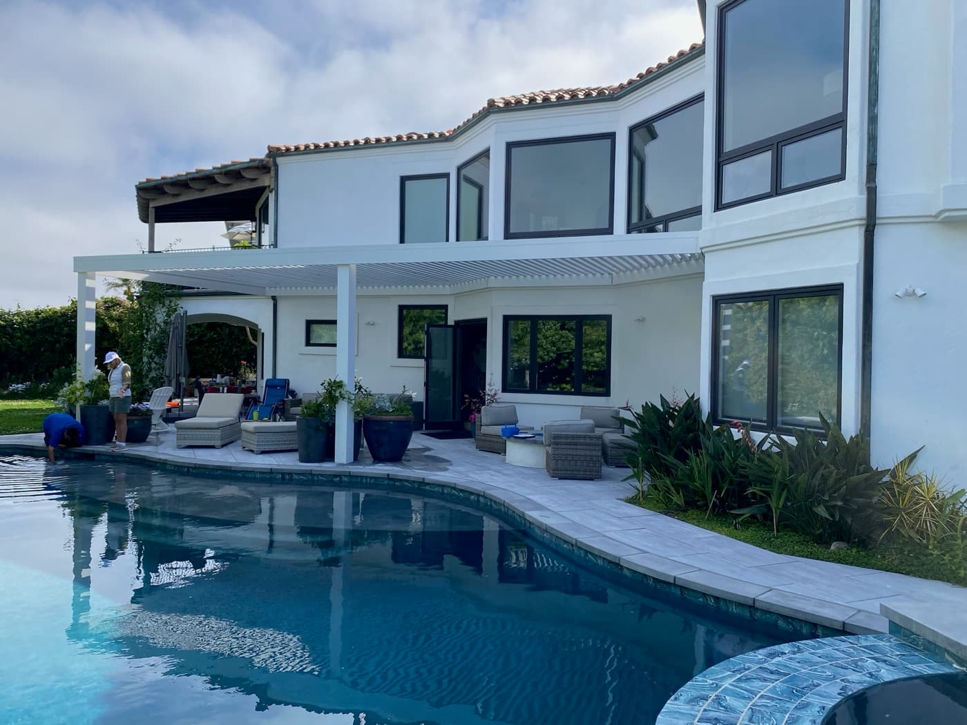 Modern pergola and pool at a Mediterranean estate in Chula Vista by Modern Yardz
