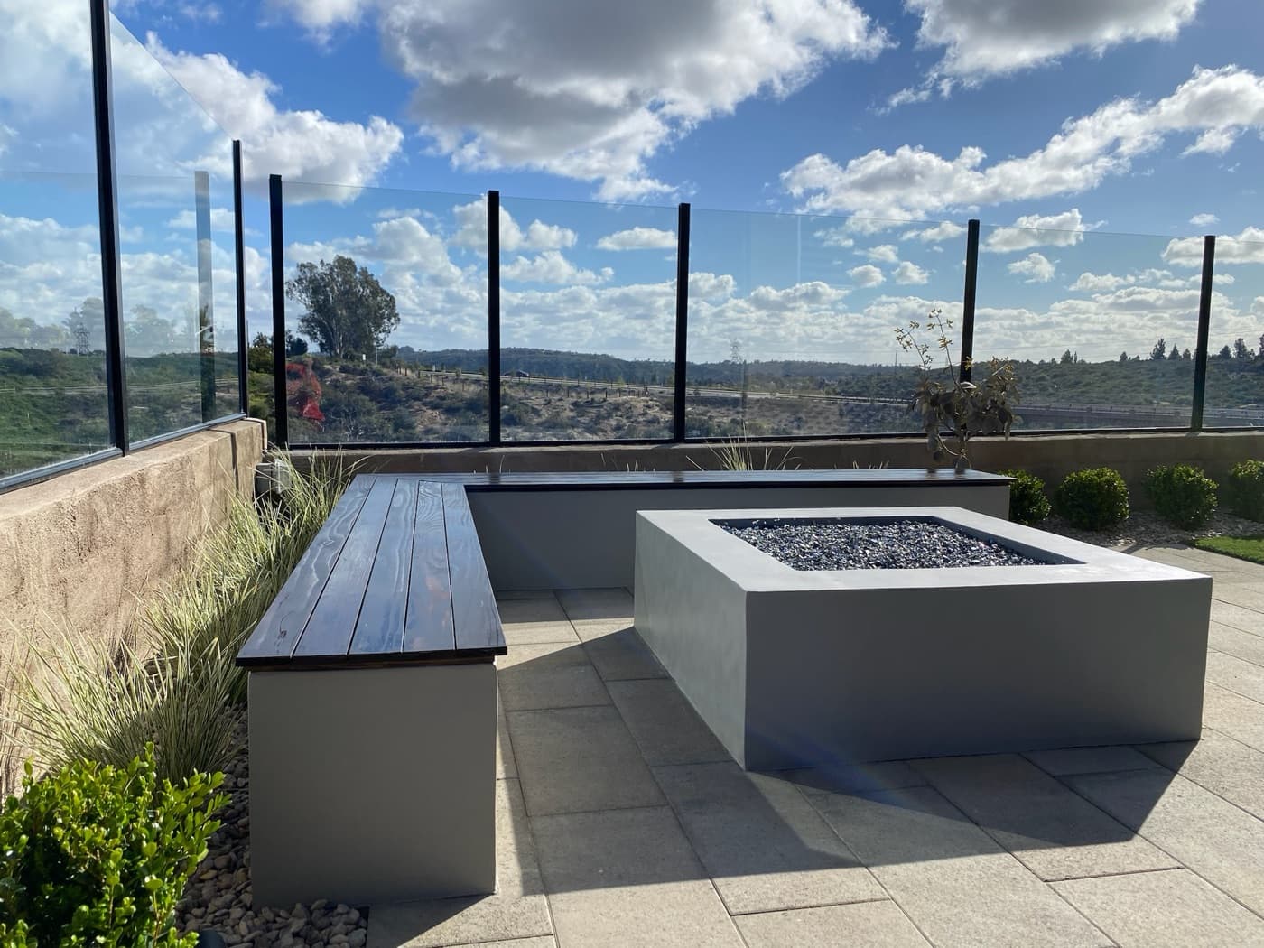 Modern fire table and floating bench overlooking the valley in Chula Vista by Modern Yardz
