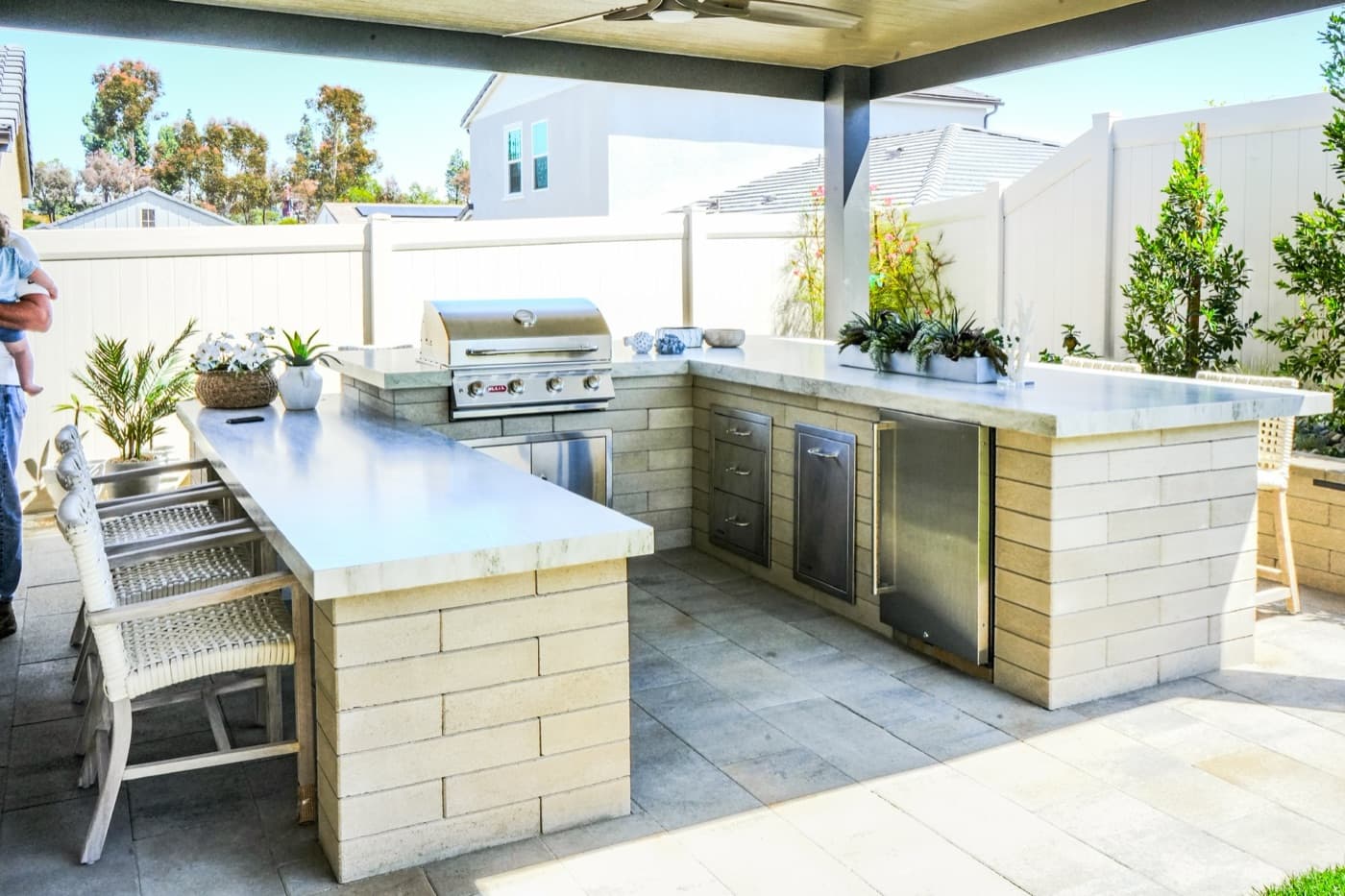 Covered outdoor kitchen and bar in Del Mar by Modern Yardz