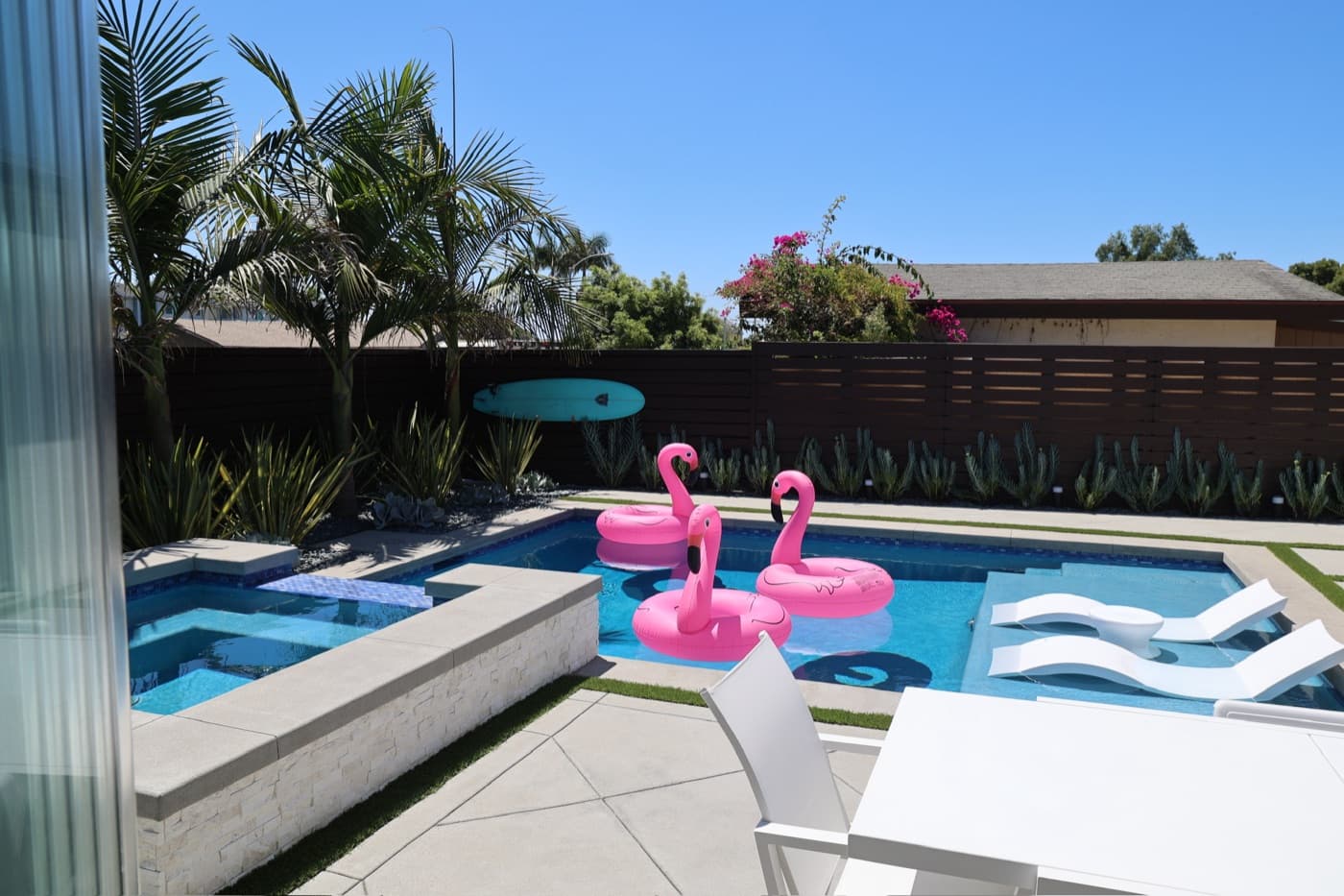 Pool and spa with a sun deck in La Jolla by Modern Yardz