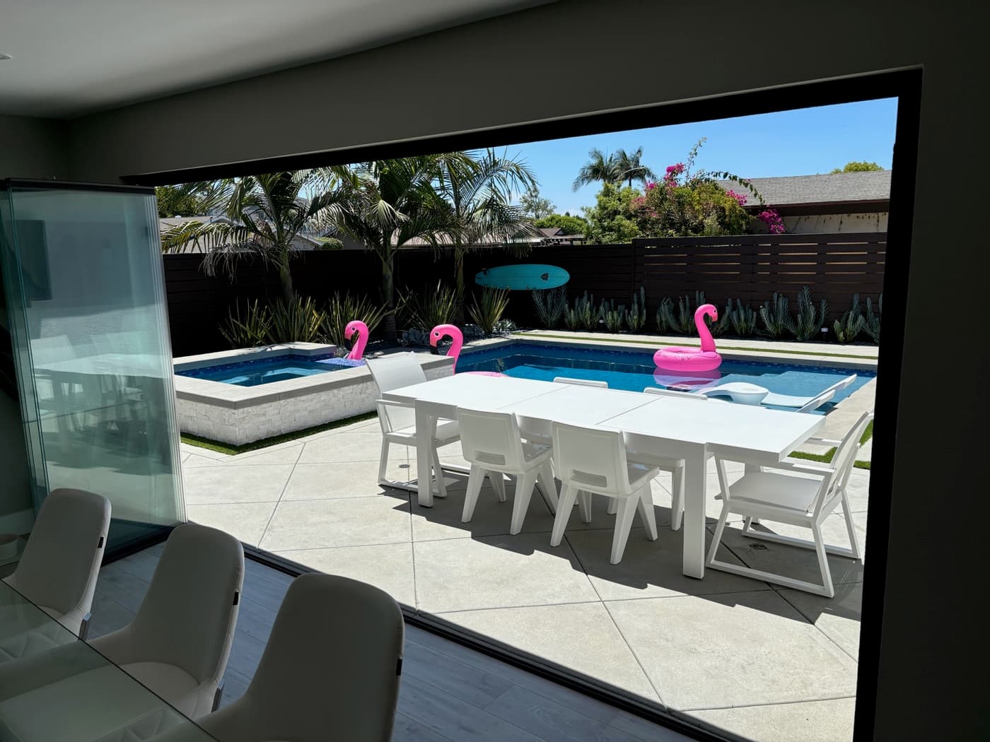 Pool and patio off the great room in La Jolla by Modern Yardz