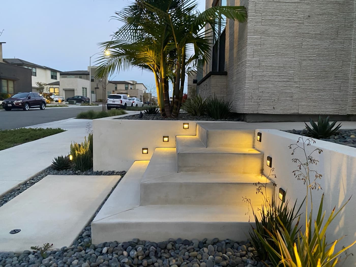 Pool with a raised spa and privacy fence in La Jolla by Modern Yardz