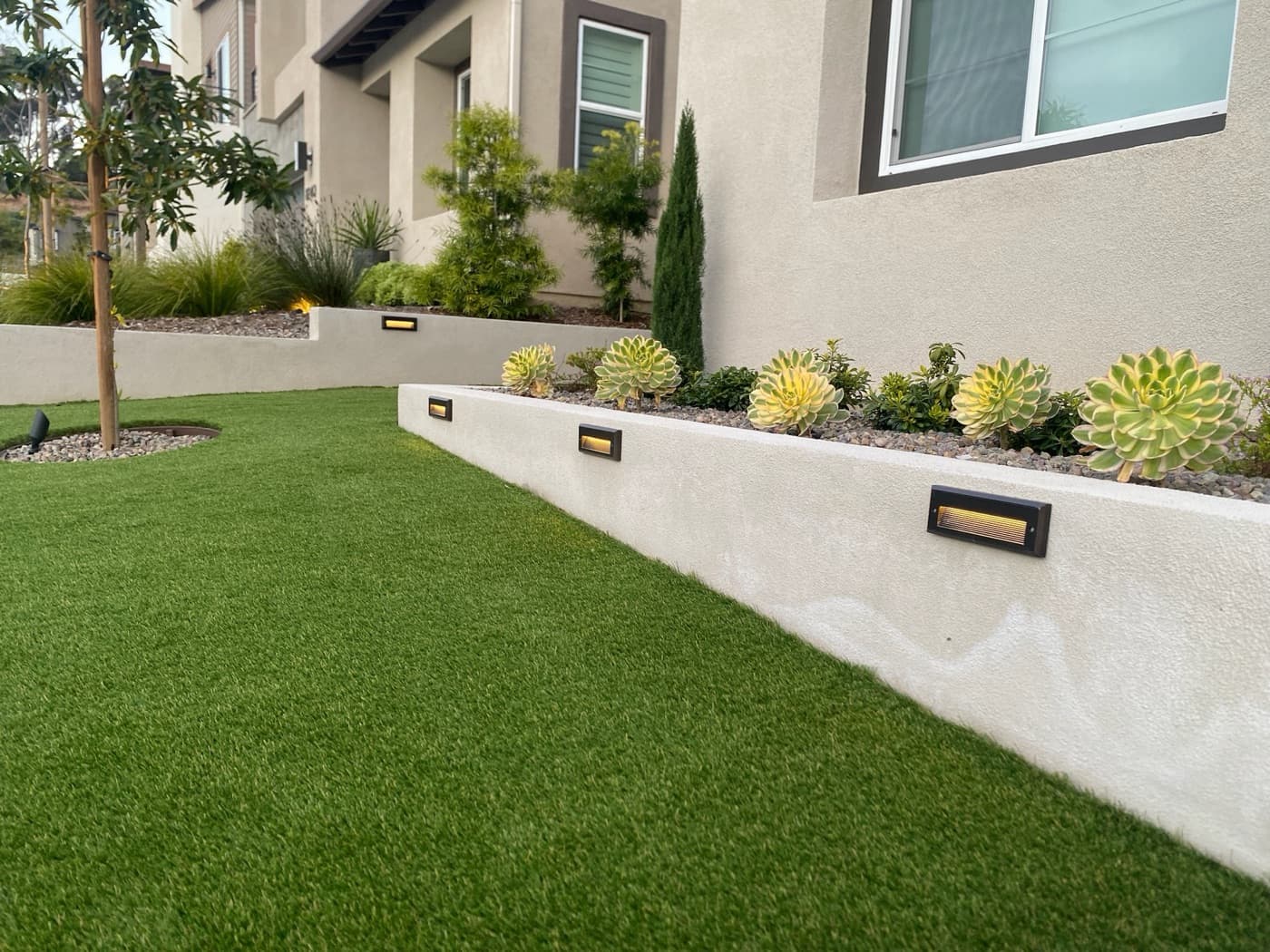 Modern front-yard planter with drought-tolerant planting in La Jolla by Modern Yardz