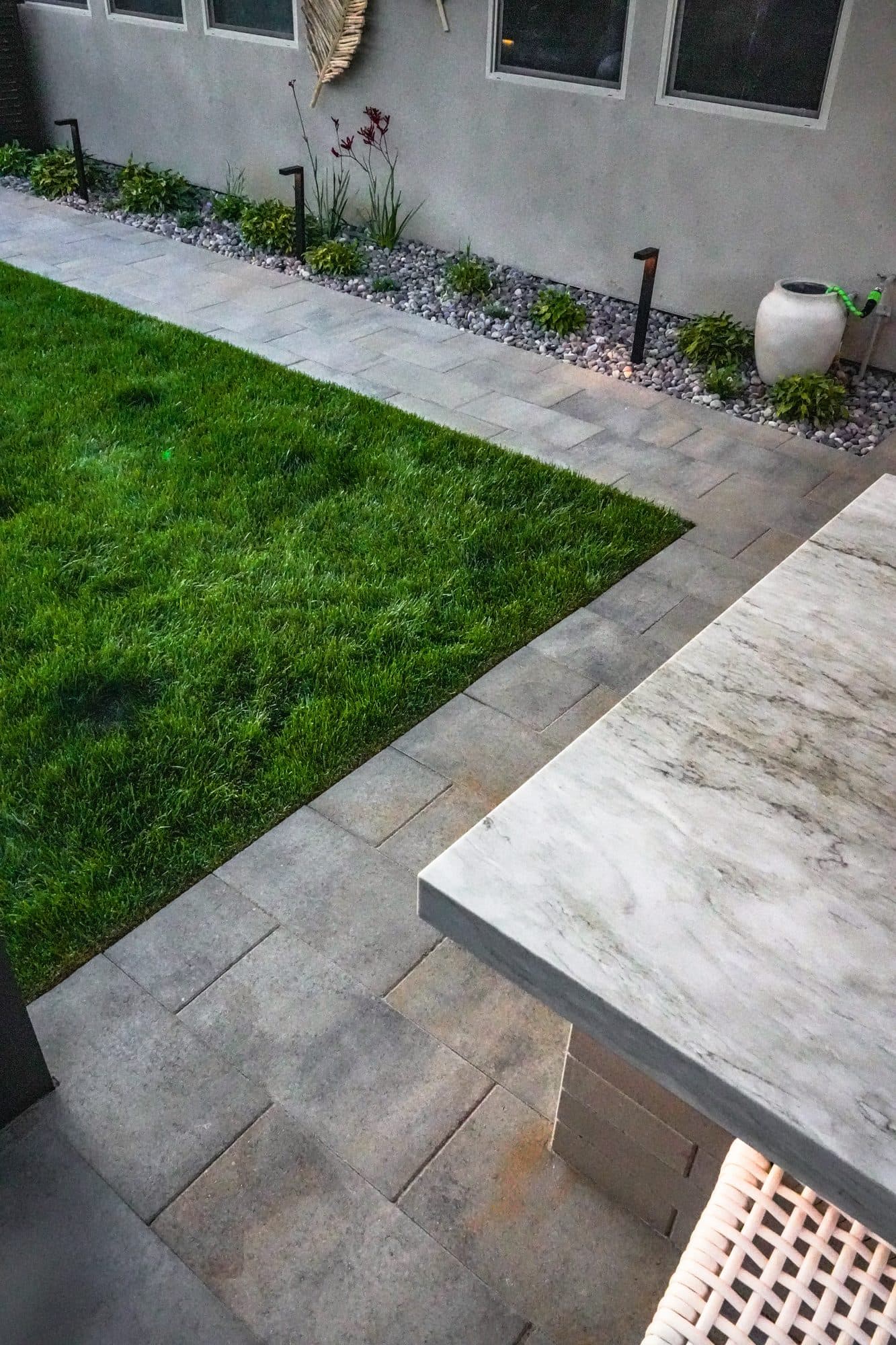 Premium paver stepping path set into the sod lawn