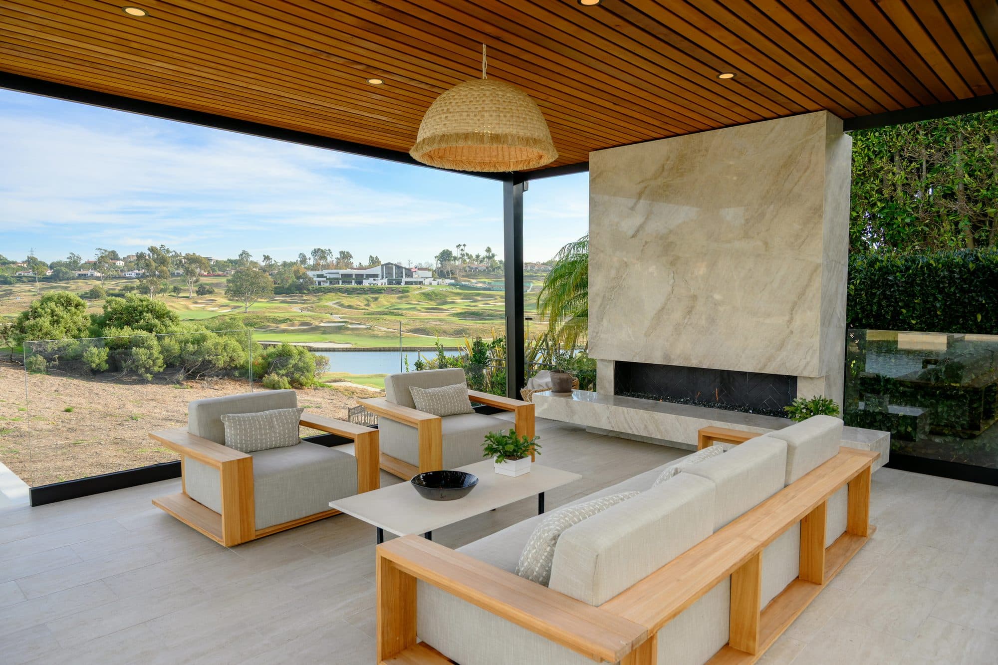 Quartzite fireplace and sectional in the covered patio facing the golf course